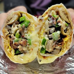 Casablanca Cafe - Breakfast Burrito with eggs, cheese, bacon, grilled onions, green peppers, mushrooms, and ranch dressing.