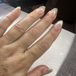 Natural acrylic fill with glitter ombre. Love the service and vibe here. Will definitely come back.