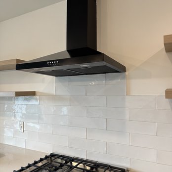 Bud Remodeling - Before - uneven shelves, modern hood, and previous tiles we were not a fan of layout. - General Contractors Near Me - Lake Forest, California