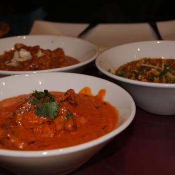 Dera - three bowls of food on a table - Pakistani Near Me - Montreal, Quebec