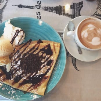 Crepes de Paris - Chocolate crêpe with a scoop of vanilla ice cream and a hot mocha. - Creperies Near Me - Brea, California Crepes de Paris - Chocolate crêpe with a scoop of vanilla ice cream and a hot mocha. - Creperies Near Me - Brea, California