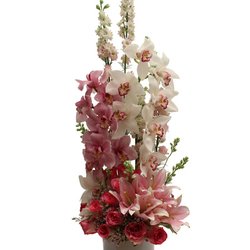 Flowers By Pouparina - Love me tender- This blend of White and Pink Cymbidium Orchids with soft pink larkspurs, pink lilies and soft pink roses