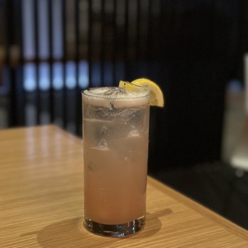 Hiro 88 - a drink on a table with a slice of lemon - Japanese Near Me - Omaha, Nebraska
