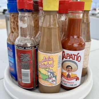 Tacos & Mariscos El Rey - Solid condiment and sauce selection on the table. - Tacos Near Me - Yuma, Arizona Tacos & Mariscos El Rey - Solid condiment and sauce selection on the table. - Tacos Near Me - Yuma, Arizona
