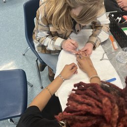 Sarah with a student
