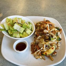 Oishii Teriyaki & Rolls - Spicy chicken stir fry with side salad.