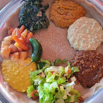 Awash Restaurant - Vegetarian plate - colorful and fun to eat! Grab injera and dip or scoop!! - Ethiopian Near Me - Los Angeles, California Awash Restaurant - Vegetarian plate - colorful and fun to eat! Grab injera and dip or scoop!! - Ethiopian Near Me - Los Angeles, California