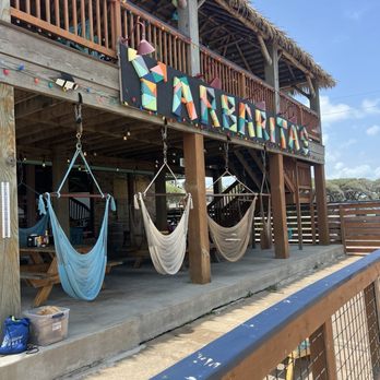Yarbarita's Sip and Swing - Sky chair swings! - New American Near Me - Rockport, Texas