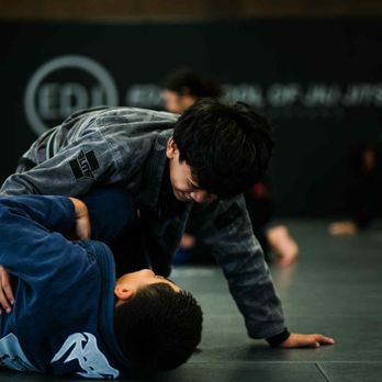 EDJ Academy HQ - Kids practicing Jiu-Jitsu with big smiles while learning discipline.
Give your child a positive outlet--try a free kids' class today! - Self-defense Classes Near Me - Corona, California EDJ Academy HQ - Kids practicing Jiu-Jitsu with big smiles while learning discipline.
Give your child a positive outlet--try a free kids' class today! - Self-defense Classes Near Me - Corona, California