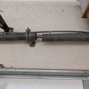 CF Garage Door - Broken spring before repair - Garage Door Services Near Me