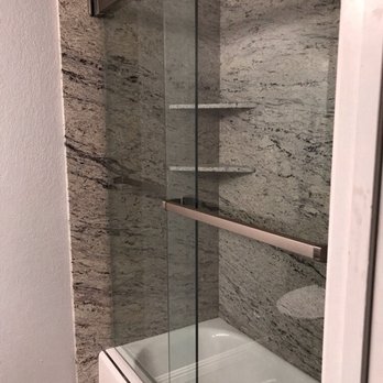 Tucker Construction - a bathroom with a glass shower door - General Contractors Near Me - San Jose, California