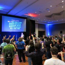 Spacecraft Entertainment - Karaoke on a large stage at a convention after party.