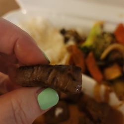 Tokyo Japanese Restaurant - All pieces of my order were like this. Burnt, dry, tough sirloin instead of the Filet Mignon we ordered and paid for.