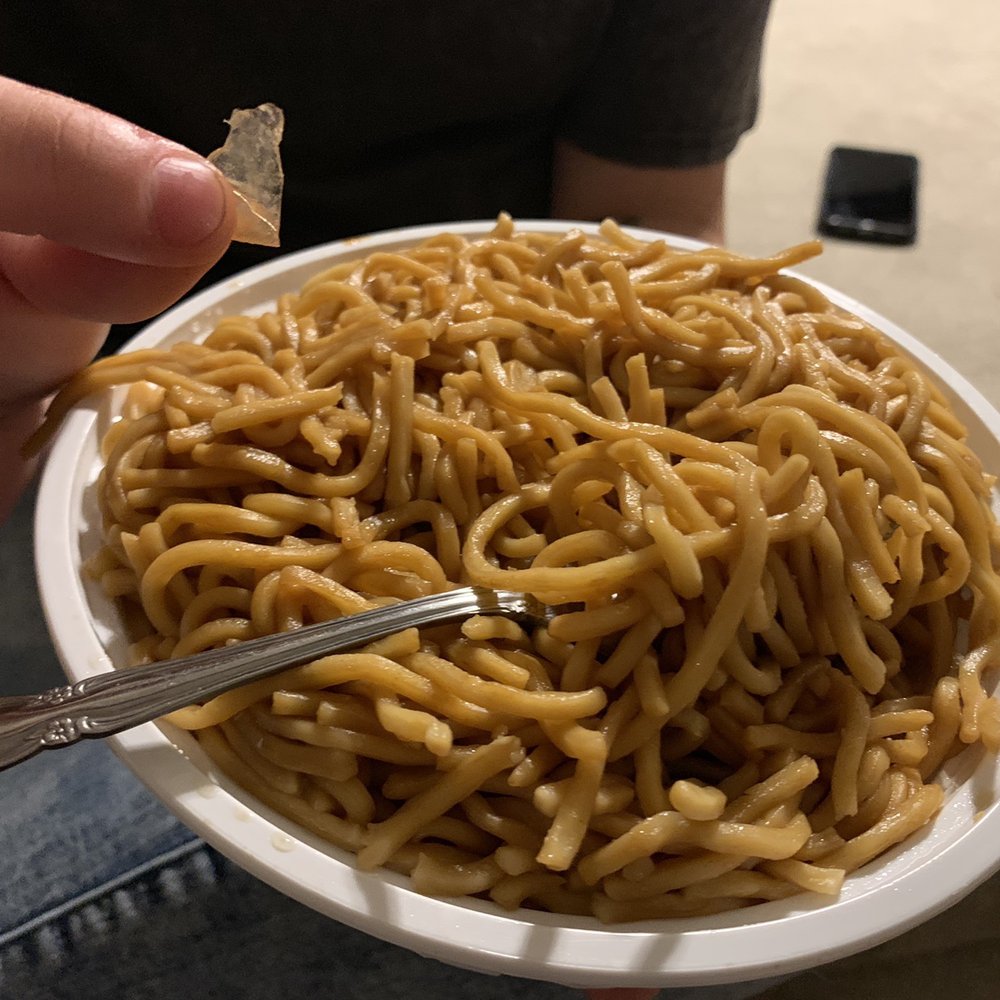Plain Lo Mein noodles with a side of plastic.