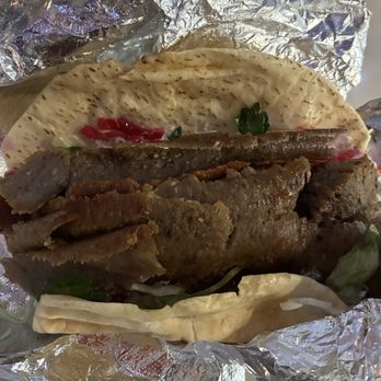 Adonis - Gyro Wrap (gyro meats slices wrapped in toasted pita with tzatziki garlic, lettuce, tomato, pickles & white cabbage - $15.78) - Mediterranean Near Me - Laguna Beach, California