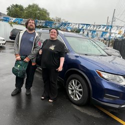 Back on Track Auto Sales - My husband, myself, and our new car!