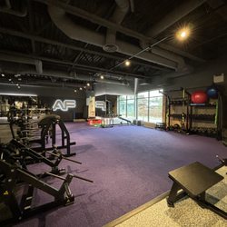 Anytime Fitness - Large turf functional area with multiple Hammer Strength and Life Fitness equipment.