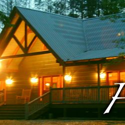Twin Rivers Resort - Our guest lodge with rocking chair front porch and cozy stone fireplace inside.
