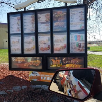 Taco Bell - a menu board and a car mirror - Fast Food Near Me - Saint John, Indiana