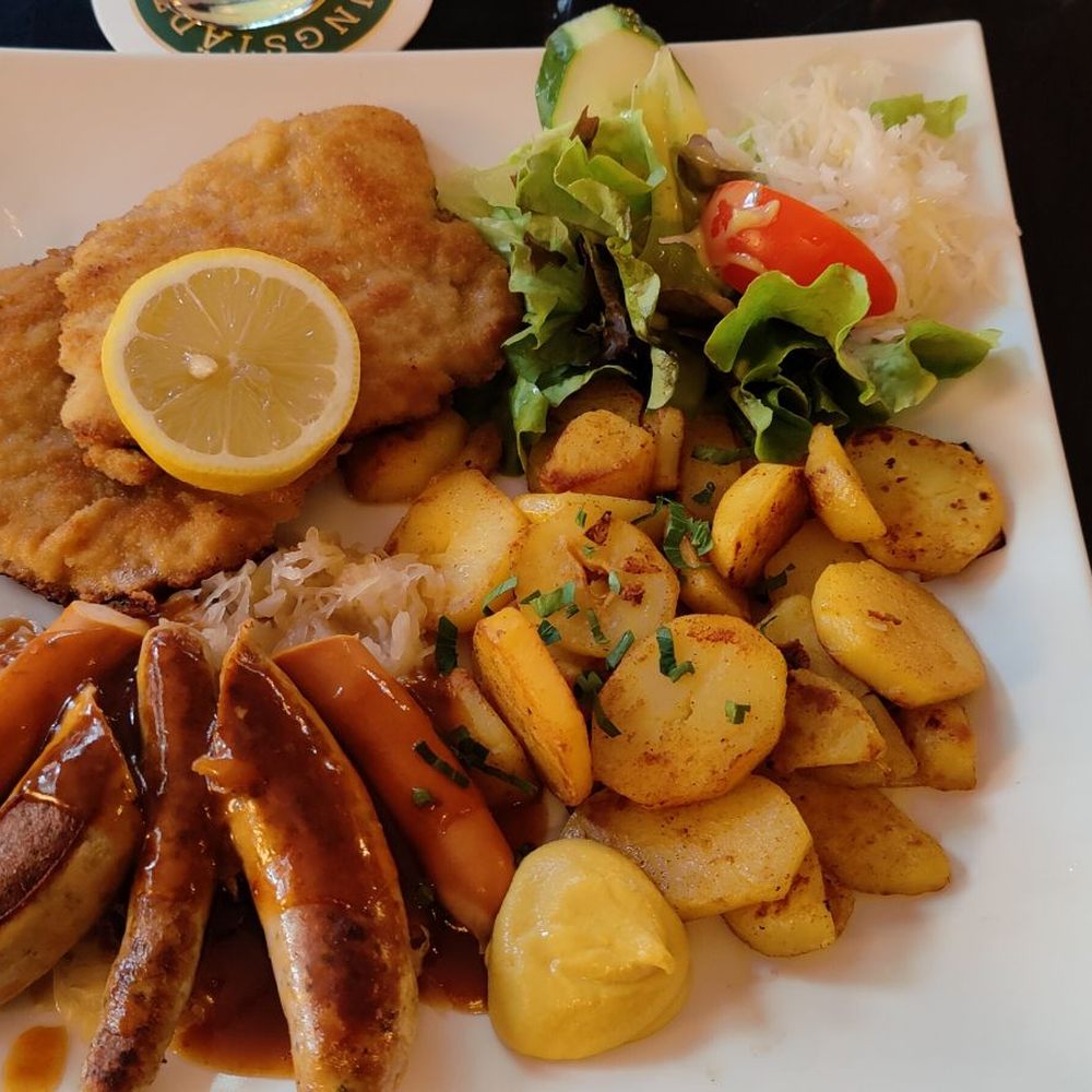Immer Satt - Classic assortment of thinly pounded schnitzel, three types of German sausage, potatoes and green salad - German Near Me - Frankfurt, HE