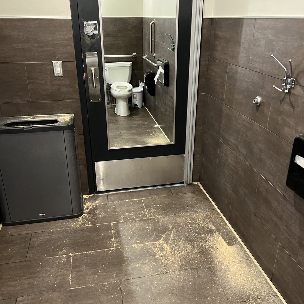 CAVA - Left hand side restroom needs serious upkeep. Both have the same dust or whatever that is. Is it safe to breathe in here? - Mediterranean Near Me - Scottsdale, Arizona