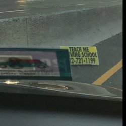 Teach Me Driving School - Do you want a driving school that cannot keep a sign on a car teaching your child?  This was on Route 1 South  Dangerous!