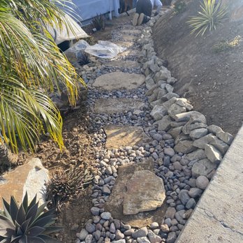 Garden Rhythms - flagstone rock and rock wall before Gorilla hair - Landscaping Near Me