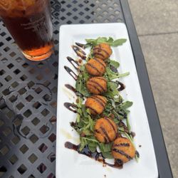 Murphys Craft House - Fried Goat Cheese with honey balsamic drizzle on arugula. Delicious