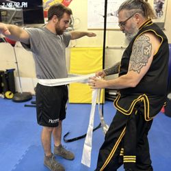 Blue Lantern Martial Arts: Shaolin Wing Chun Kung Fu - It is an honor for your Sifu to tie on your sash. It represents the passing on of knowledge.