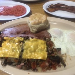 Country ham, loaded hash browns, sliced tomatoes, eggs over easy, and biscuit Country ham, loaded hash browns, sliced tomatoes, eggs over easy, and biscuit