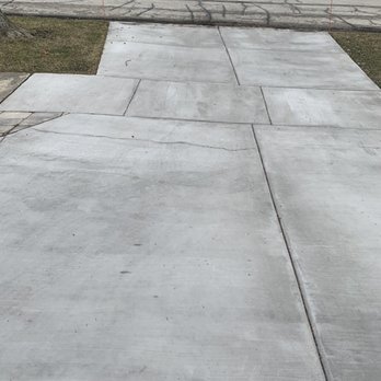 Chicagoland Garage Builders - Huge crack across the driveway, plus more discoloration and scaling. - Garage Door Services Near Me - Melrose Park, Illinois