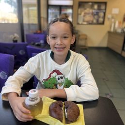 L enjoying her chocolate bagel L enjoying her chocolate bagel