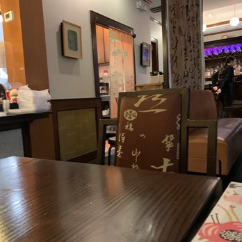 Wild Ginger - a dining room with tables and chairs - Asian Fusion Near Me - Smithtown, New York