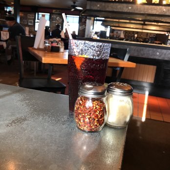 Pizza Hut - a jar of pepperoni and a jar of pepperoni on a table - Pizza Near Me - Caldwell, Texas
