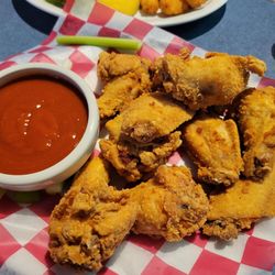 Channel Marker Pub & Grill - Broasted chicken wings! with sauces on the side.