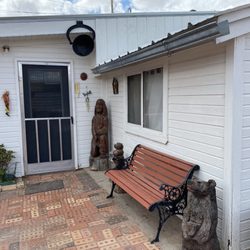 Indian Springs Bath Houses - Door to the office with a wooden Indian in the corner