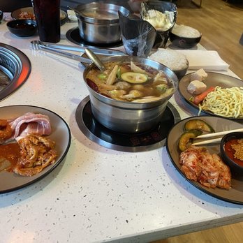 Hi Pot - Spicy hot pot base, several types of raw meat, kimchi, custom sauce, noodles, and tofu. - Korean Near Me - Myrtle Beach, South Carolina