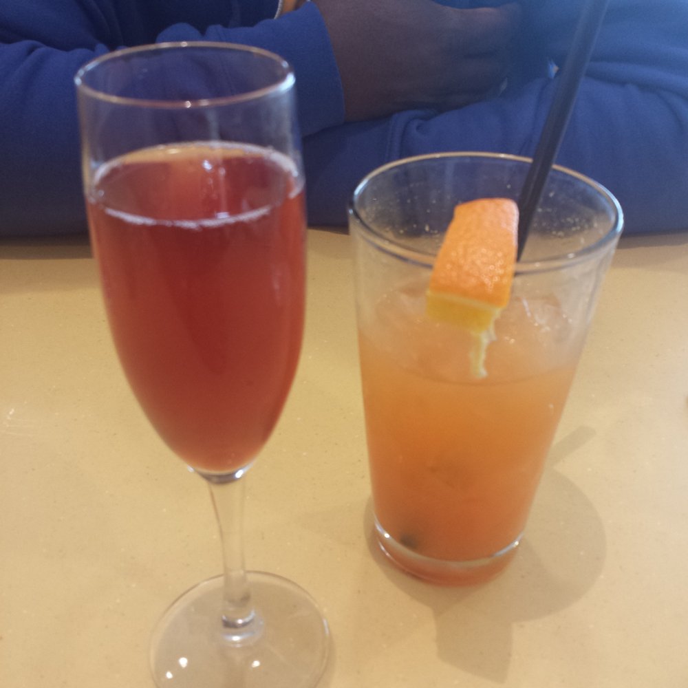Wild Eggs - Left - pomegranate mimosa Right: tequila sunrise. They need to step up the look and taste of these drinks. - Breakfast & Brunch Near Me - Carmel, Indiana Wild Eggs - Left - pomegranate mimosa Right: tequila sunrise. They need to step up the look and taste of these drinks. - Breakfast & Brunch Near Me - Carmel, Indiana