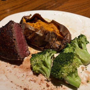 Outback Steakhouse - Part of my filet, sweet potato and soft yet firm broccoli. Leftovers. - Steakhouses Near Me - Burlington, North Carolina Outback Steakhouse - Part of my filet, sweet potato and soft yet firm broccoli. Leftovers. - Steakhouses Near Me - Burlington, North Carolina