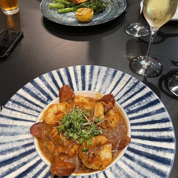Spurrier's Gridiron Grille - Shrimp and grits - American Near Me - Gainesville, Florida