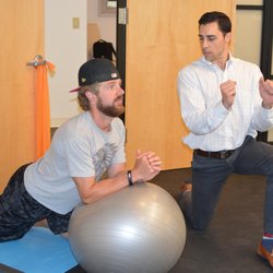 Norwalk Sports & Spine - Demonstrating Stretches & Exercises
