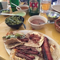 Cinthya's - Arranchera steak taco w/cheese, Argentinian sausage taco w/cheese w/pico de gallo, hot sauces, pickled cactus . Que Rico!
