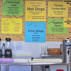 The Sandwich Hut - Additional menu items on the back wall behind the counter.