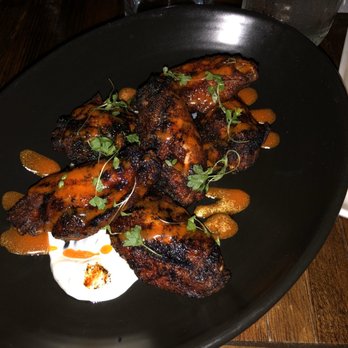Repeal 33 - Charred wings - Memphis dry rubbed, sweet vinegar, Gorgonzola ranch, carrot-chile emulsion - Bars Near Me - Savannah, Georgia