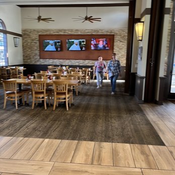 Becks Prime - two people walking through a restaurant - Burgers Near Me - Houston, Texas