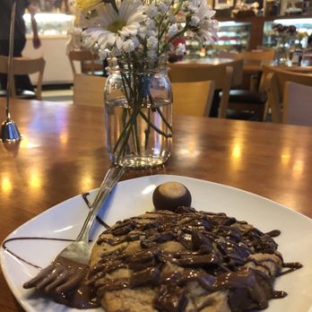 Chocolate Café - Giant chocolate chip cookie with a tiny Buckeye - Desserts Near Me - Columbus, Ohio Chocolate Café - Giant chocolate chip cookie with a tiny Buckeye - Desserts Near Me - Columbus, Ohio