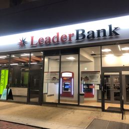 Exterior outside entrance of Leader Bank - Leader Bank's Cambridge Branch in Central Square at night. - Cambridge, Massachusetts Exterior outside entrance of Leader Bank - Leader Bank's Cambridge Branch in Central Square at night. - Cambridge, Massachusetts
