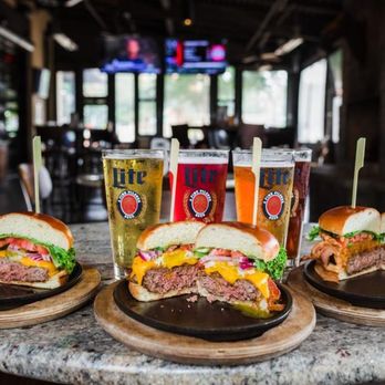 CharBar No 7 - three burgers and two beers on a table - Burgers Near Me - Southern Pines, North Carolina CharBar No 7 - three burgers and two beers on a table - Burgers Near Me - Southern Pines, North Carolina