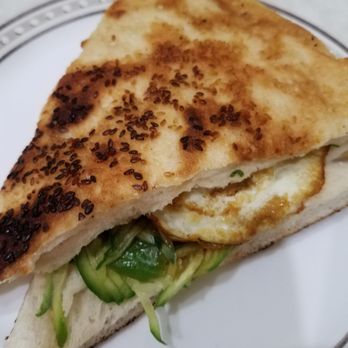 Beijing Dumpling - Sesame pancake with egg and cucumber. Tasty but a bit salty. - Chinese Near Me - Forest Hills, New York Beijing Dumpling - Sesame pancake with egg and cucumber. Tasty but a bit salty. - Chinese Near Me - Forest Hills, New York