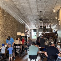 The Buzz Cafe - Interior, exposed brick, furnished nicely and has outside sidewalk seating too.